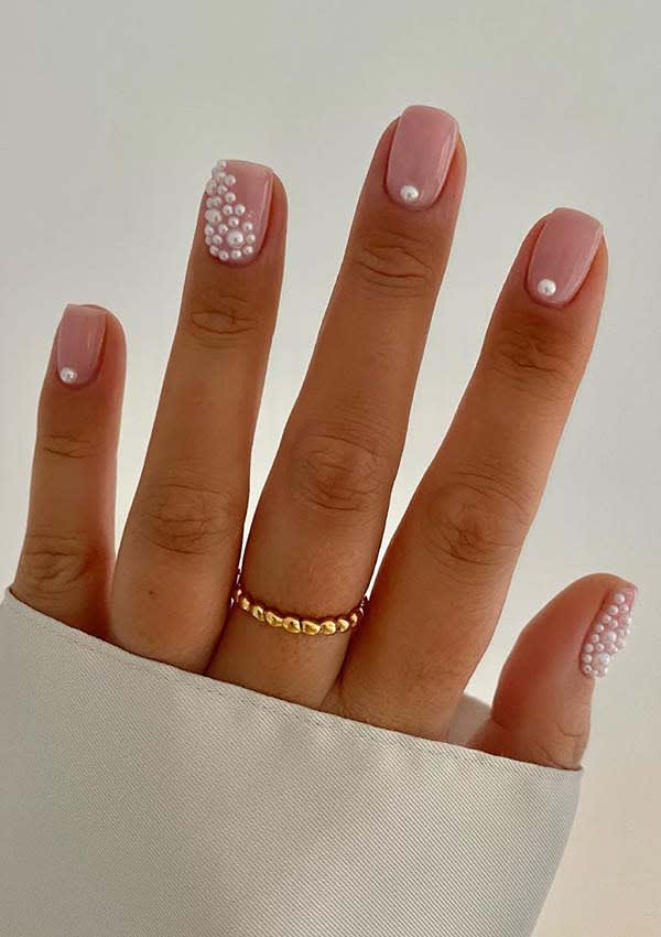 disenos-de-de-unas-color-naranja-con-piedras-y-perlas-4