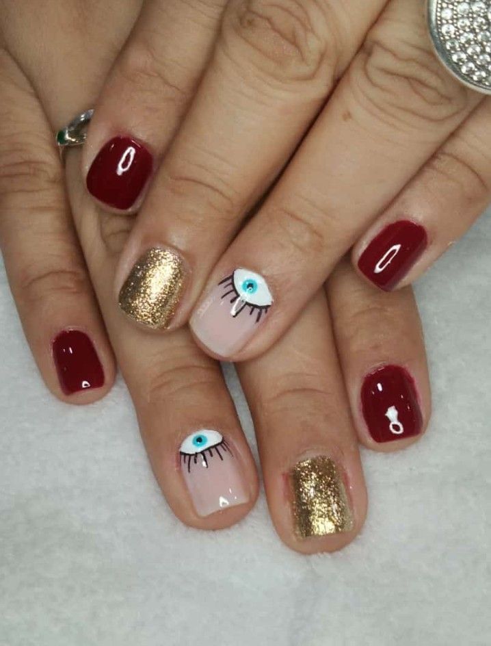 unas-en-gelish-color-vino-diseno-de-ojo-2